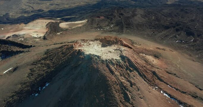 Aerial view of volcano crater. Aerial footage. Inside the volcano crater white smoke. Teide.