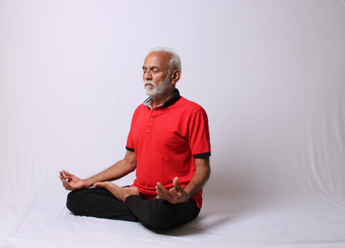 senior Indian man in yoga pose