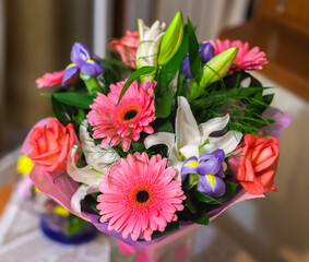 Bouquet with roses, gerberas, lilies and irises
