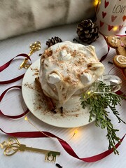 Christmas cup of hot coffee cocoa with marshmallow on a wooden decorated background. Christmas and New Year holidays, family weekend activities.