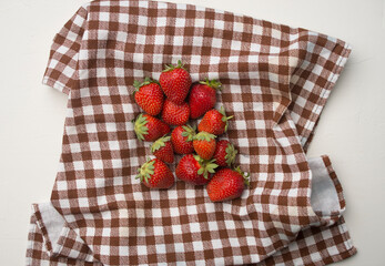 strawberry on checkered fabric