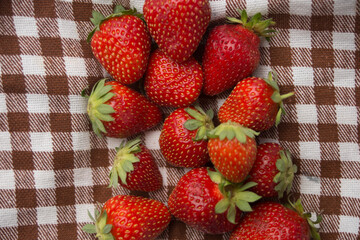 strawberry on checkered fabric