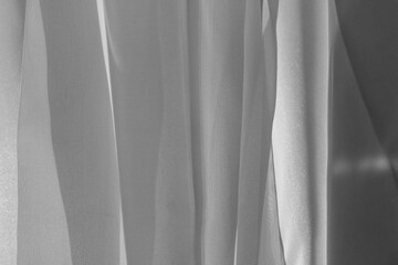 white folds of fabric close-up. fabric in sunlight, with beautiful shadows.