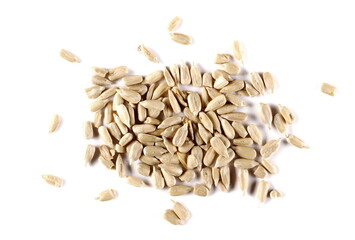 Peeled sunflower seeds isolated on white background, top view