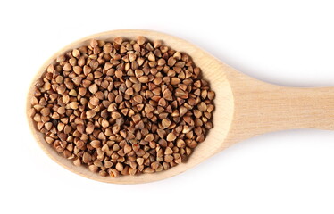 Buckwheat seeds in wooden spoon isolated on white background, top view