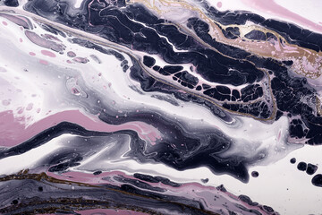 Lilac waves and black graphite bubbles mix with golden waves. Fluid Art. Marble effect background or texture