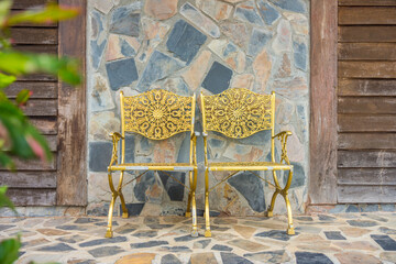 Two old metal armchairs at porch. The furnitures for outdoor at home.