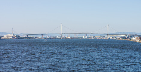 Fototapeta na wymiar Konohana Bridge over the sea. It is located at Osaka bay in Japan.