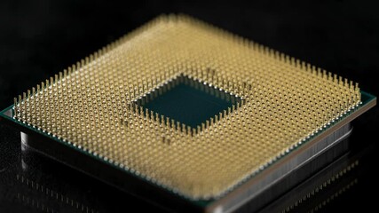 Powerful central processing unit presented in macro. Contact feet are gold plated for less resistance. The CPU is the heart of computers and servers. - Powered by Adobe