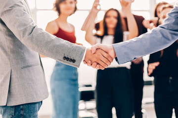 young business people shaking hands with each other.