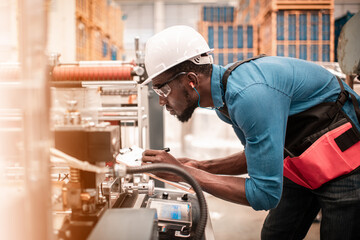 Technician working in factory check functionality while commissioning a production line, Man working