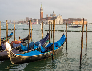 Fototapeta na wymiar Parking gondolas at the Traghetto Gondole Molo, St Mark's Square - Venice, Veneto, Italy