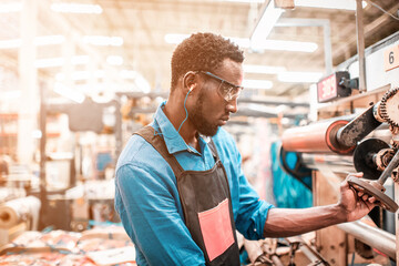 Obraz premium Technician working in factory check functionality while commissioning a production line, Man working