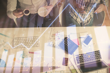 Double exposure of man and woman working together and financial chart hologram drawing. market analysis concept. Computer background. Top View.