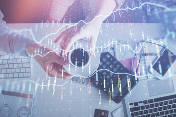 Double exposure of man and woman working together and financial chart hologram drawing. market analysis concept. Computer background. Top View.