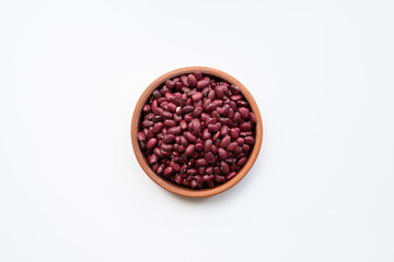 red kidney beans in brown ceramic bowl. bowl of red kidney beans on white background isolated top view photo