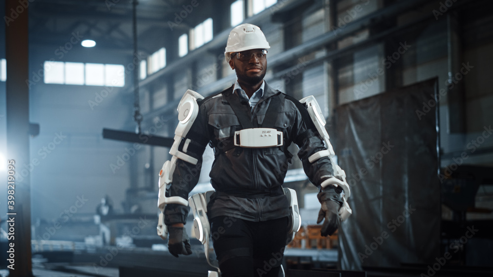 Poster black african american engineer is testing a futuristic bionic exoskeleton and proudly wearing it in