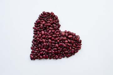 red kidney beans heart shape isolated on white background top view photo