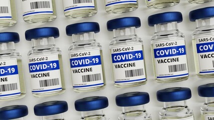 Viele Fläschchen Corona Impfstoff von oben auf weißem Untergrund