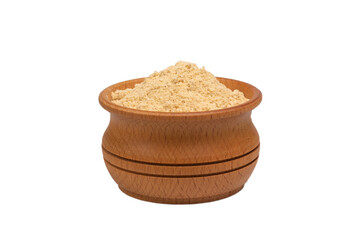Bio organic dried ginger powder in wooden bowl