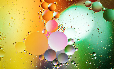 multicolored circles on the water space macro photography