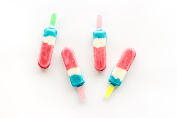 Pattern of ice cream on sticks. Colorful popsicle, top view