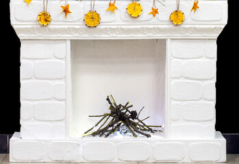 Traditional fireplace with marble lining and christmas decorations