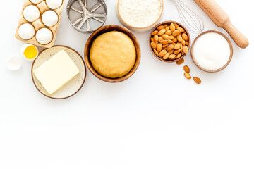 Baking homemade cake or cookie - dough in bowl with ingredients, top view