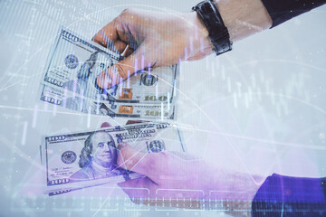 Multi exposure of financial graph drawing hologram and USA dollars bills and man hands. Analysis concept.