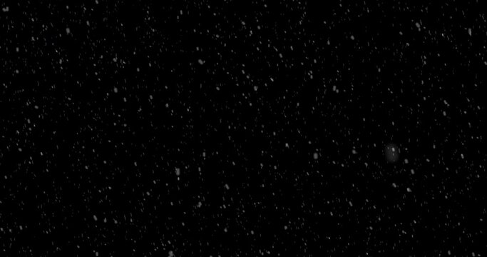 Falling snow against black background for overlay. Alpha.
