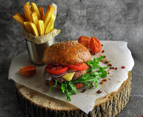 Burger on a wooden board.