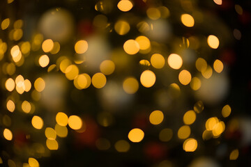 Golden abstract blurred defocused bokeh background. Abstract light background with light spots
