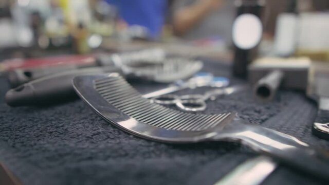 Combs and brushes to create hairstyles on the barber's table