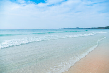 Beach on a day with good weather With the light from the sun very bright And the sea has soft waves