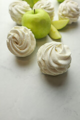 Homemade zephyr with apple taste on light background