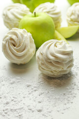 Homemade zephyr with apple taste on light background