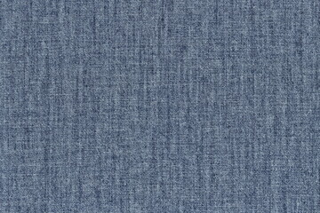 Fototapeta na wymiar The texture of natural blue cotton denim. Classic natural jeans.
