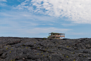 Obraz premium wooden house on the lava