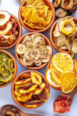 Organic Healthy Assorted Dried Fruit Mix close up. Dried fruit snacks. dried apples, mango, feijoa, dried apricots, prunes top view