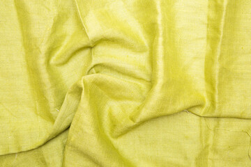 yellow wrinkled fabric