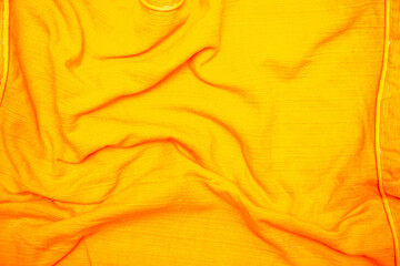 Orange wrinkled fabric background
