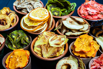 Organic Healthy Assorted Dried Fruit Mix close up. Dried fruit snacks. dried apples, mango, feijoa, dried apricots, prunes top view