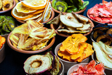 Organic Healthy Assorted Dried Fruit Mix close up. Dried fruit snacks. dried apples, mango, feijoa, dried apricots, prunes top view