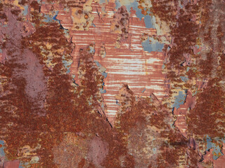 Rust.Old blue painted wall with rust spots.Textured rusty metal background. Rust stains through the cracked blue paint.