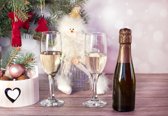 A bottle and a glass of champagne. New year's eve and Christmas