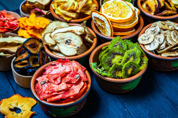 Organic Healthy Assorted Dried Fruit Mix close up. Dried fruit snacks. dried apples, mango, feijoa, dried apricots, prunes top view