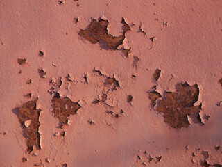 Rust.Old blue painted wall with rust spots.Textured rusty metal background. Rust stains through the cracked blue paint.