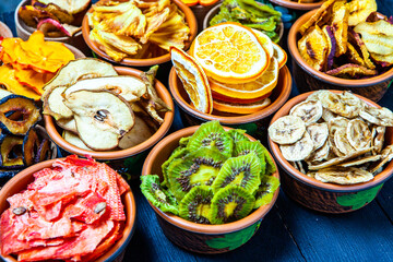 Organic Healthy Assorted Dried Fruit Mix close up. Dried fruit snacks. dried apples, mango, feijoa, dried apricots, prunes top view