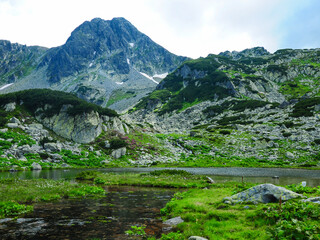 One of the many glacial lakes that retezat National Park has. A small creek springs from this lake and flows into the valley.