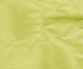 Fototapeta premium yellow craft paper with wrinckles surface.